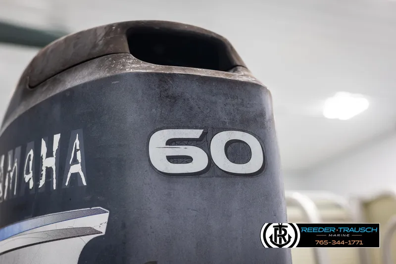 Slide: The Image of Close-up of a Yamaha 60 horsepower outboard motor on a 2002 Suncruiser Trinidad 224. - 41