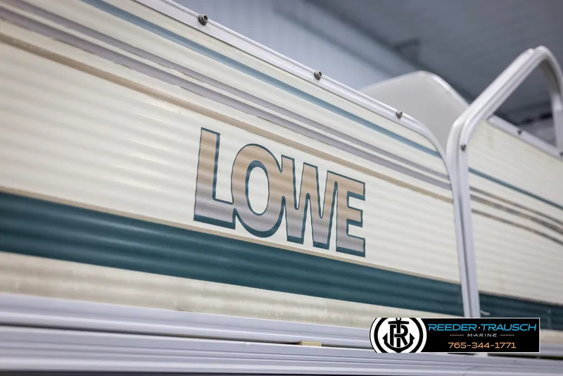 Slide: The Image of 2002 Suncruiser Trinidad 224 pontoon boat with Lowe branding. - 45