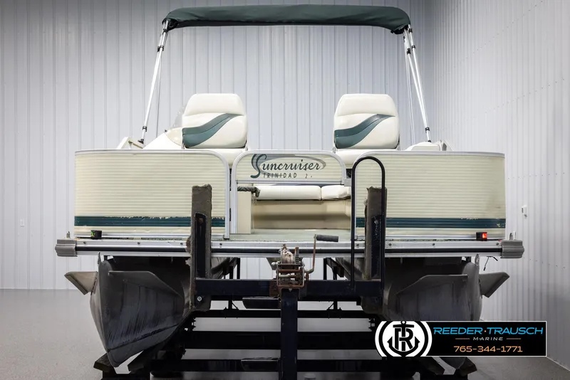 Slide: The Image of 2002 Suncruiser Trinidad 224 pontoon boat in a showroom. - 8
