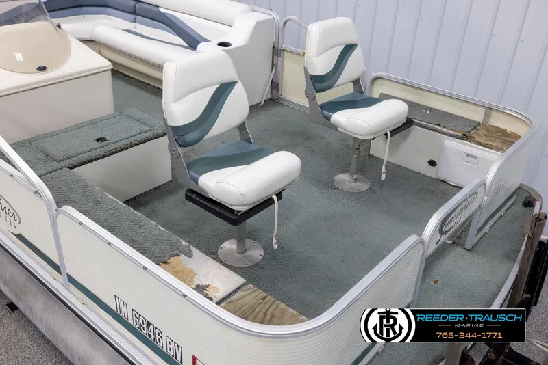 Slide: The Image of 2002 Suncruiser Trinidad 224 pontoon boat interior with seating and carpeted deck. - 9