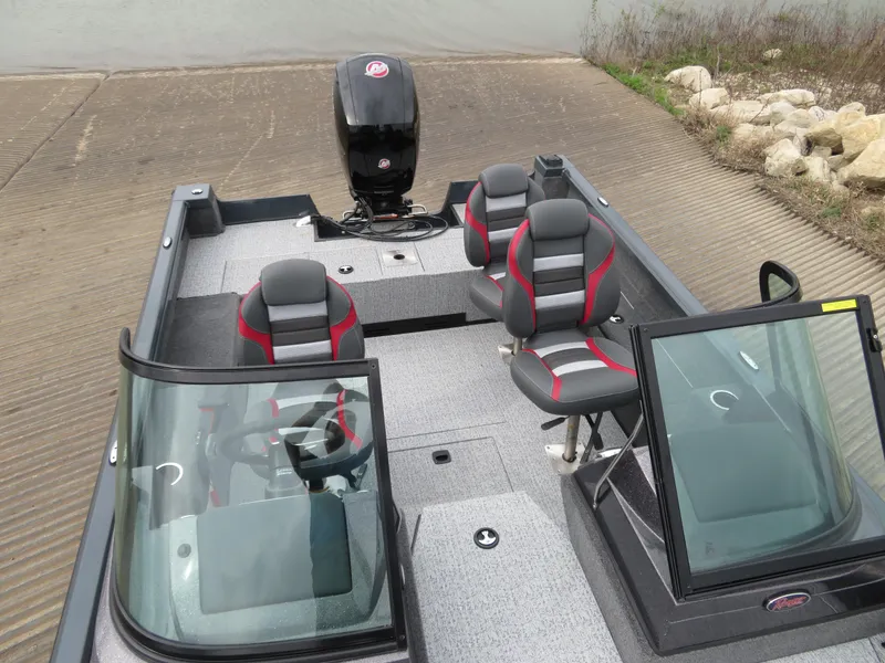 Slide: The Image of 2024 Ranger VS1782SC Angler boat with seating and motor at a boat ramp. - 12