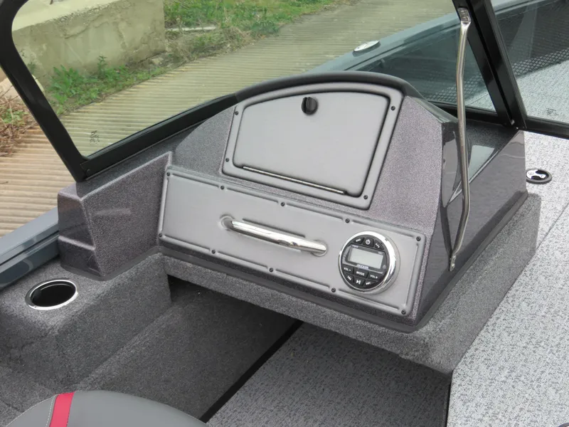 Slide: The Image of 2024 Ranger VS1782SC Angler boat dashboard with storage compartment and control panel. - 4