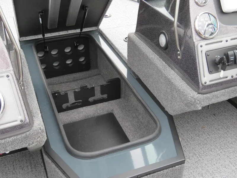 Slide: The Image of 2024 Ranger VS1782SC Angler boat storage compartment and dashboard controls. - 9