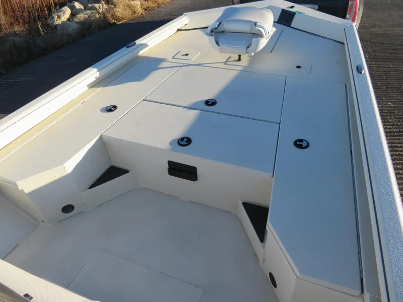 Slide: The Image of 2024 Ranger RB200 boat interior with storage compartments and seating. - 9