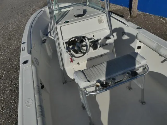 Slide: The Image of 2011 Sailfish 218 CC boat interior with steering wheel and seating. - 13