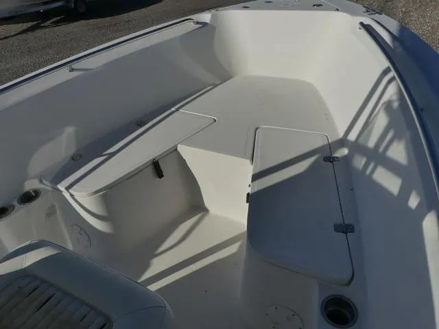 Slide: The Image of 2011 Sailfish 218 CC boat interior with seating and storage compartments. - 14