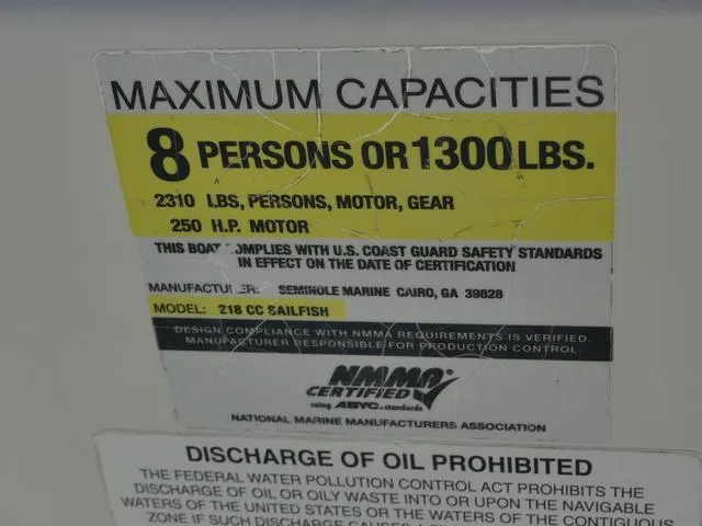 Slide: The Image of Label showing maximum capacity for Sailfish 218 CC boat: 8 persons or 1300 lbs, 250 HP motor. - 22