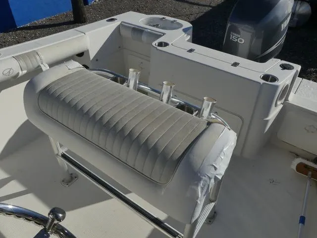 Slide: The Image of 2011 Sailfish 218 CC boat interior with seating and rod holders. - 32