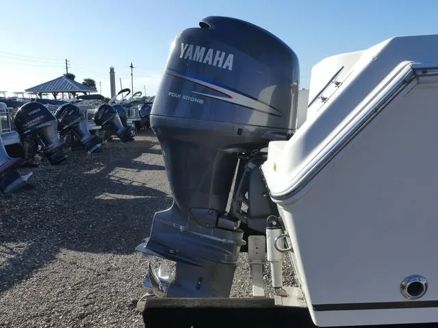 Slide: The Image of 2011 Sailfish 218 CC with Yamaha outboard motor in a boatyard. - 44