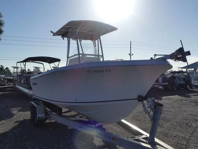 Slide: The Image of 2011 Sailfish 218 CC boat on trailer in sunny outdoor setting. - 5