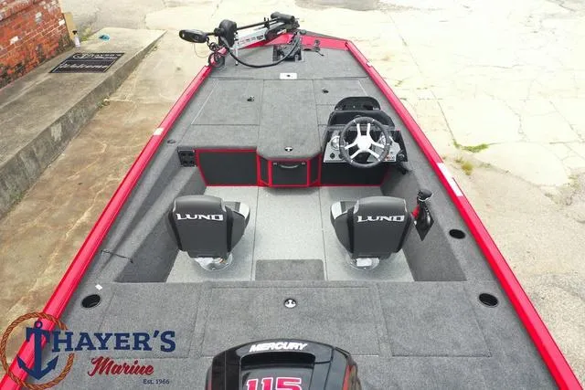 Slide: The Image of 2024 Lund 1875 Renegade SS fishing boat interior with dual seats and Mercury engine. - 10