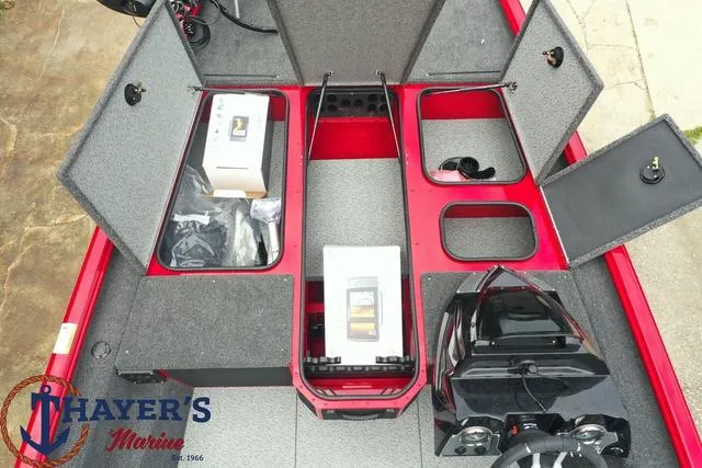 Slide: The Image of 2024 Lund 1875 Renegade SS boat interior with storage compartments open. - 13