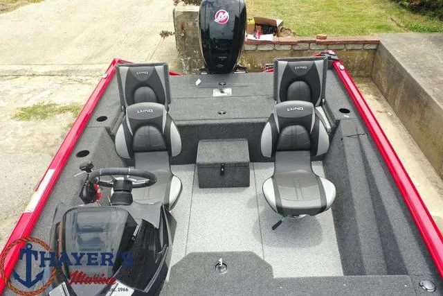 Slide: The Image of 2024 Lund 1875 Renegade SS fishing boat interior with seating and steering console. - 15