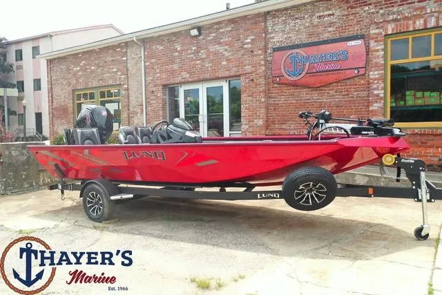 Slide: The Image of 2024 Lund 1875 Renegade SS boat in red, displayed at Thayer's Marine. - 21