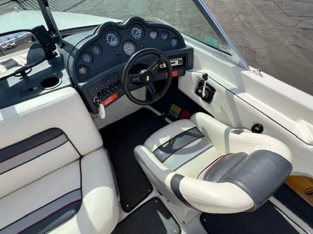Slide: The Image of 1992 Sea Ray Ski Ray boat interior with steering wheel and dashboard. - 10