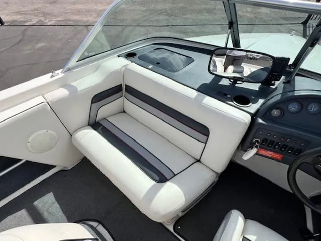 Slide: The Image of 1992 Sea Ray Ski Ray boat interior with white and black seating. - 11