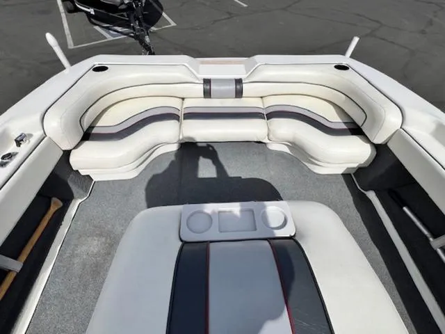 Slide: The Image of 1992 Sea Ray Ski Ray boat interior with white and black seating. - 12