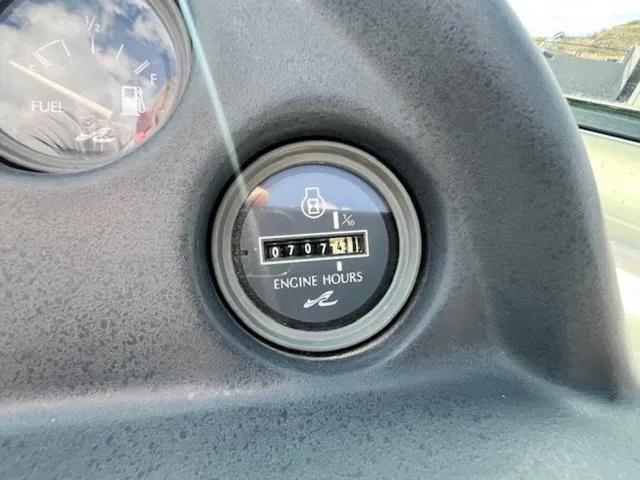 Slide: The Image of 1992 Sea Ray Ski Ray engine hours gauge showing 707.6 hours. - 14