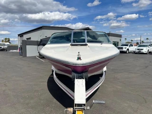 Slide: The Image of 1992 Sea Ray Ski Ray boat on trailer in parking lot under blue sky. - 3