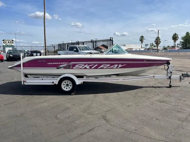 Slide: The Image of 1992 Sea Ray Ski Ray boat on a trailer in a parking lot. - 5