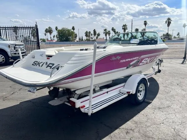 Slide: The Image of 1992 Sea Ray Ski Ray boat on a trailer in a parking lot. - 6