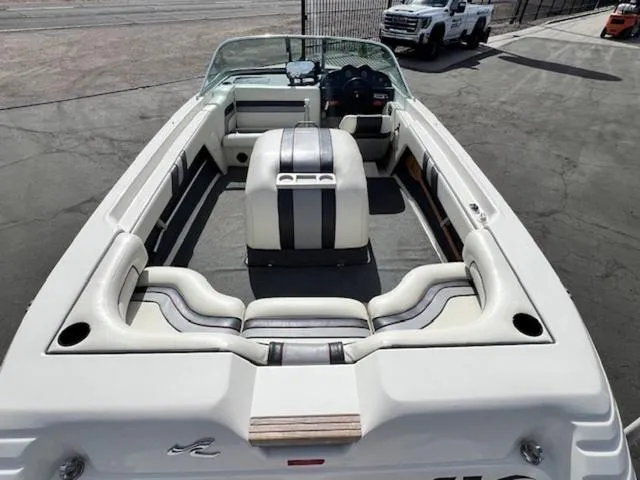 Slide: The Image of 1992 Sea Ray Ski Ray boat interior with white and gray seating. - 9