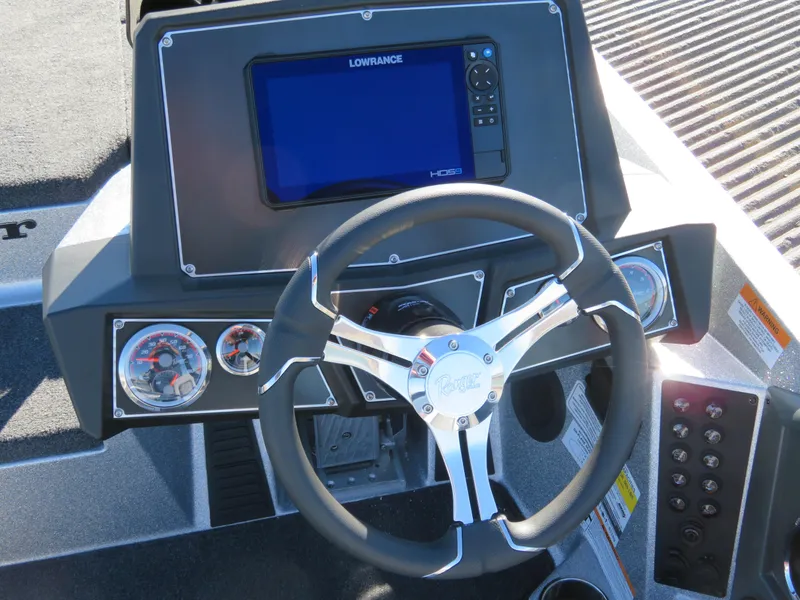 Slide: The Image of 2024 Ranger Z518 Ranger Cup Equipped dashboard with Lowrance HDS display and steering wheel. - 5