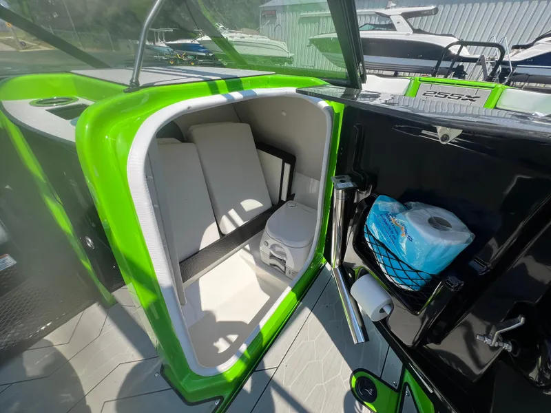Slide: The Image of 2022 Yamaha Boats 255XD interior storage and toilet compartment. - 9