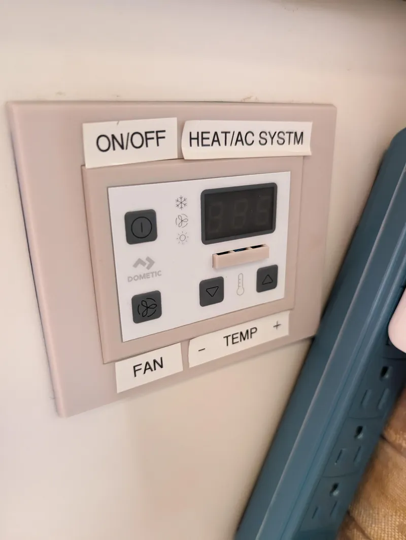 Slide: The Image of Thermostat control panel on a 1995 Sea Ray 380 Sun Sport boat. - 11