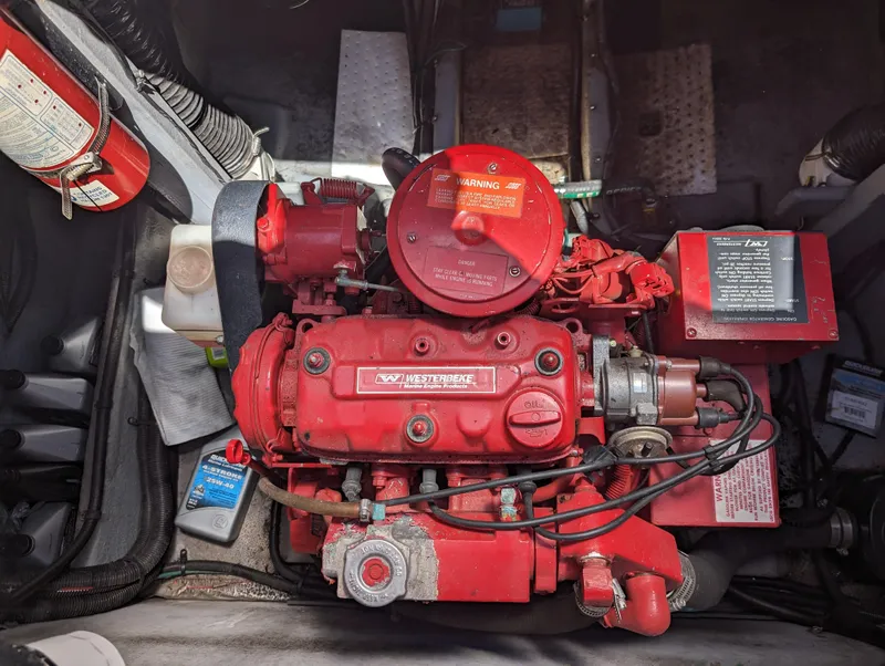Slide: The Image of Engine compartment of a 1995 Sea Ray 380 Sun Sport boat with a red Westerbeke generator. - 18