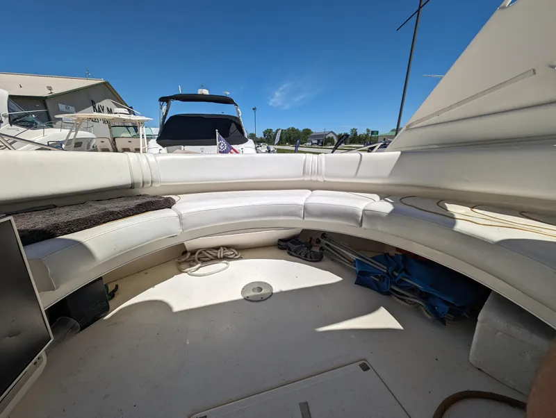 Slide: The Image of 1995 Sea Ray 380 Sun Sport boat interior with white seating and open deck. - 5
