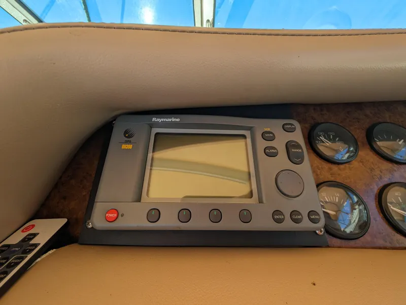 Slide: The Image of Raymarine navigation system on a 1995 Sea Ray 380 Sun Sport boat dashboard. - 9