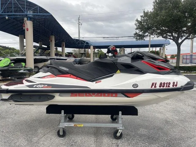 Slide: The Image of 2016 Sea-Doo RXP Waverunner on display, parked outdoors. - 10