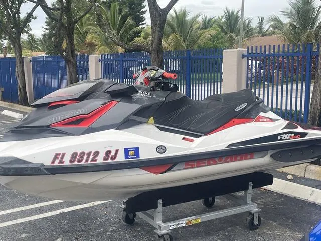 Slide: The Image of 2016 Sea-Doo Waverunner RXP parked in a lot. - 4
