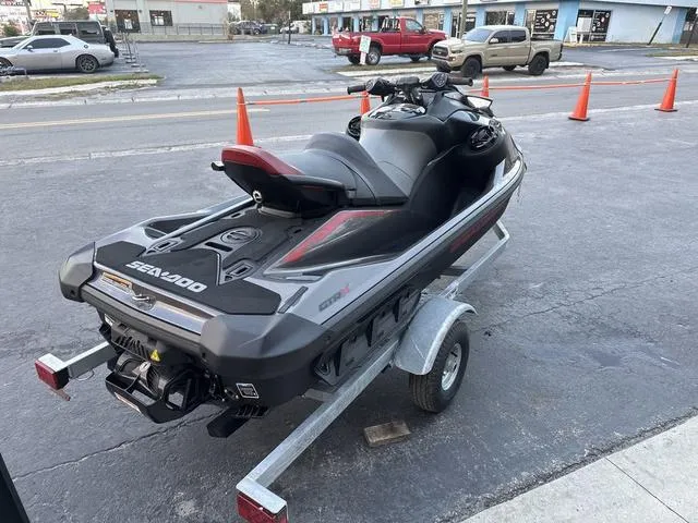 Slide: The Image of 2024 Sea-Doo Waverunner PWC GTR X 300 on trailer, parked outdoors. - 4