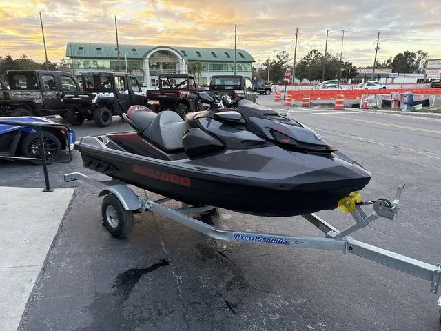 Slide: The Image of 2024 Sea-Doo Waverunner PWC GTR X 300 with sleek black and red seat design. - 5