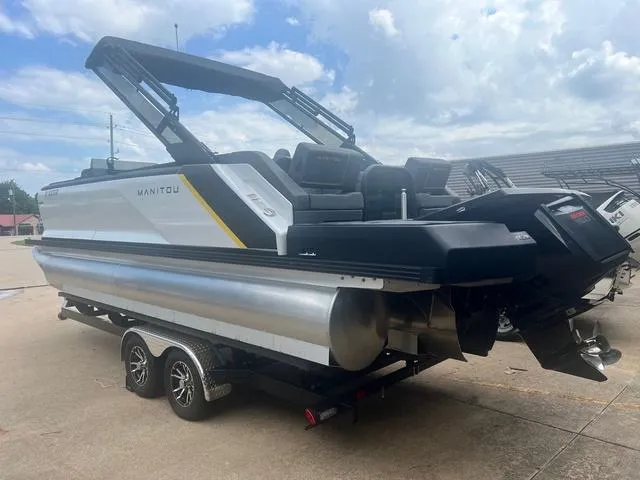 Slide: The Image of 2023 Manitou Explore 22 Bench pontoon boat on a trailer. - 8
