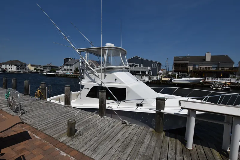 The Image of 1994 Cabo 35 Flybridge Sportfisher docked at a marina. - 16