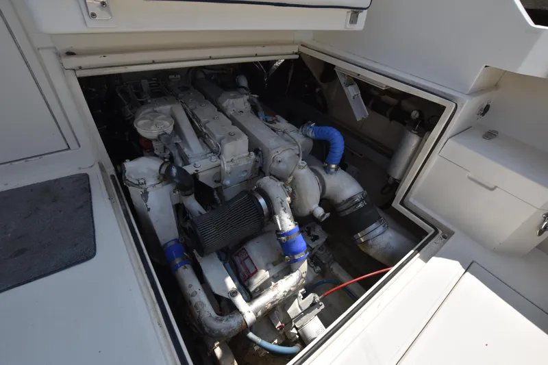 Slide: The Image of Engine compartment of a 1994 Cabo 35 Flybridge Sportfisher boat. - 31
