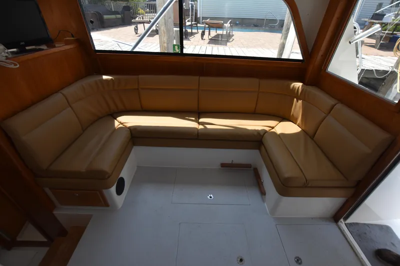 Slide: The Image of 1994 Cabo 35 Flybridge Sportfisher interior with tan leather seating. - 33