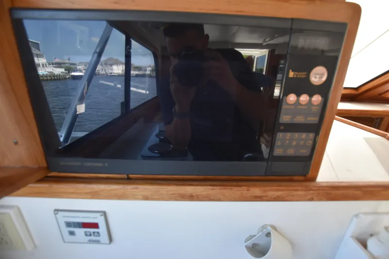 Slide: The Image of Microwave in the galley of a 1994 Cabo 35 Flybridge Sportfisher. - 38