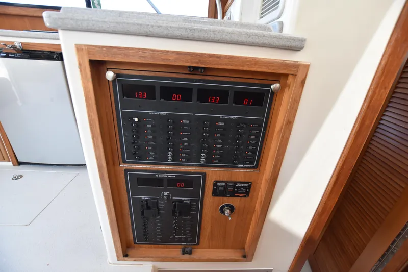 Slide: The Image of Electrical control panel on a 1994 Cabo 35 Flybridge Sportfisher boat. - 42