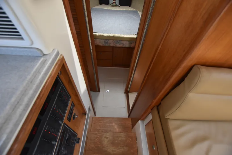 Slide: The Image of Interior view of 1994 Cabo 35 Flybridge Sportfisher, showing cabin and control panel. - 43