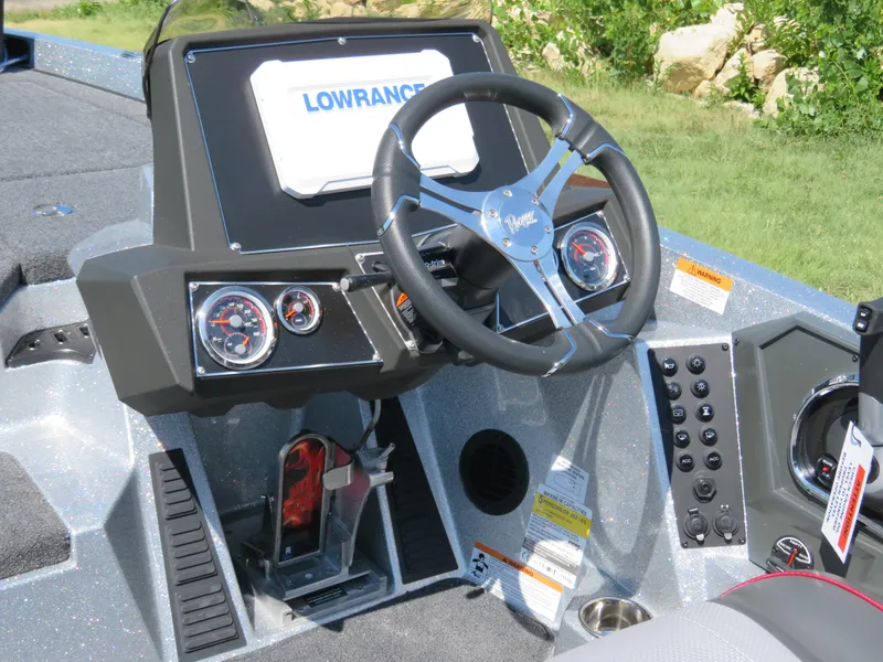 Slide: The Image of 2024 Ranger Z519 Ranger Cup Equipped boat dashboard with Lowrance electronics and steering wheel. - 3