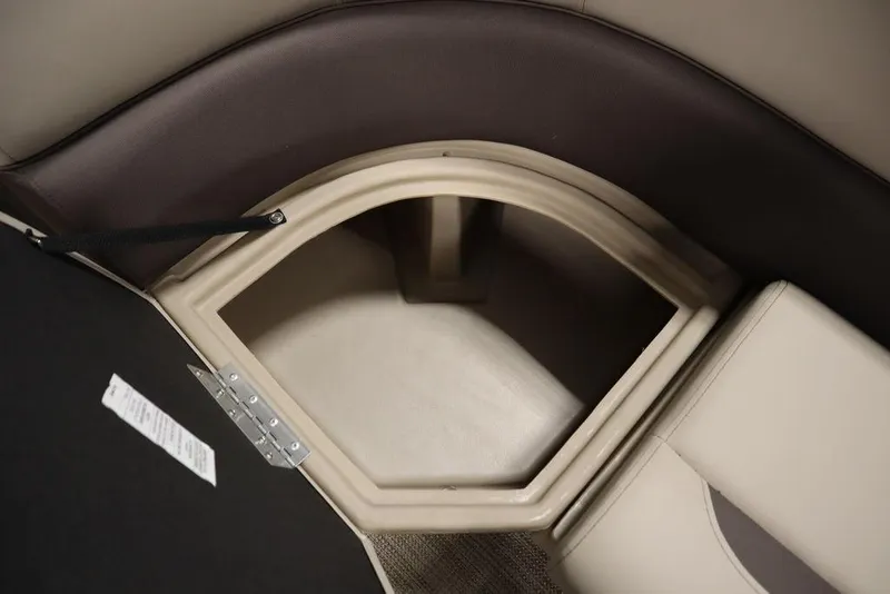 Slide: The Image of 2025 Bentley Pontoons 223 QSB Tri-Toon storage compartment with beige interior. - 18