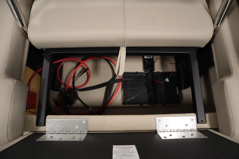 Slide: The Image of 2025 Bentley Pontoons 223 QSB Tri-Toon under-seat storage with wiring and battery compartment. - 23