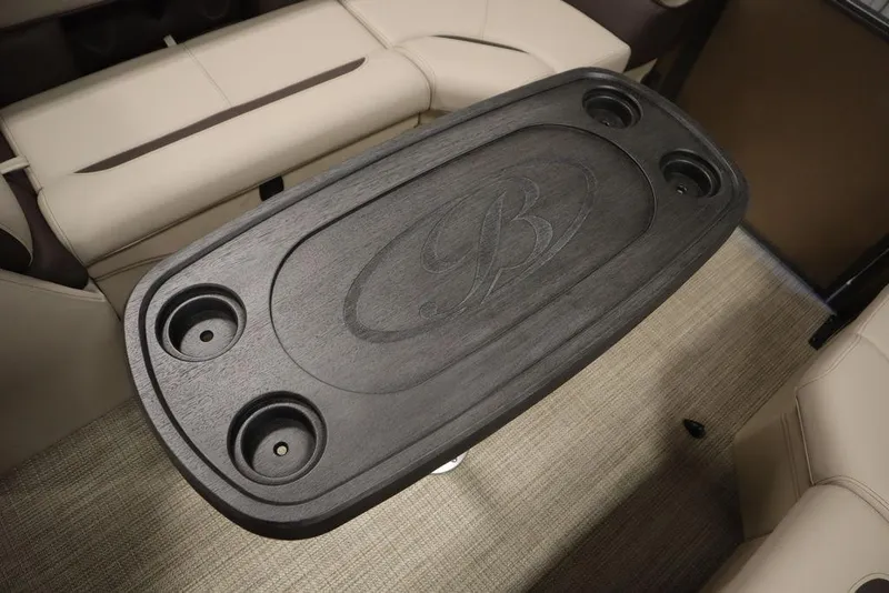 Slide: The Image of 2025 Bentley Pontoons 223 QSB Tri-Toon interior table with cup holders. - 29
