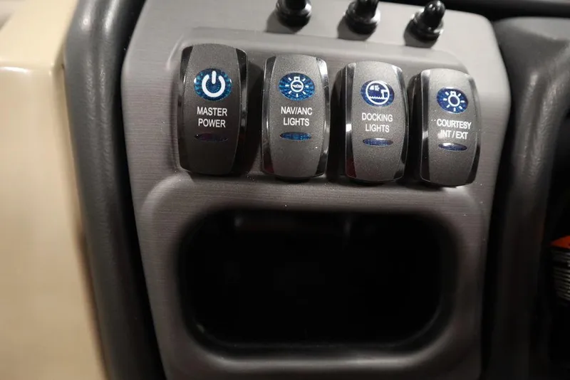 Slide: The Image of Control panel of 2025 Bentley Pontoons 223 QSB Tri-Toon with labeled switches. - 30