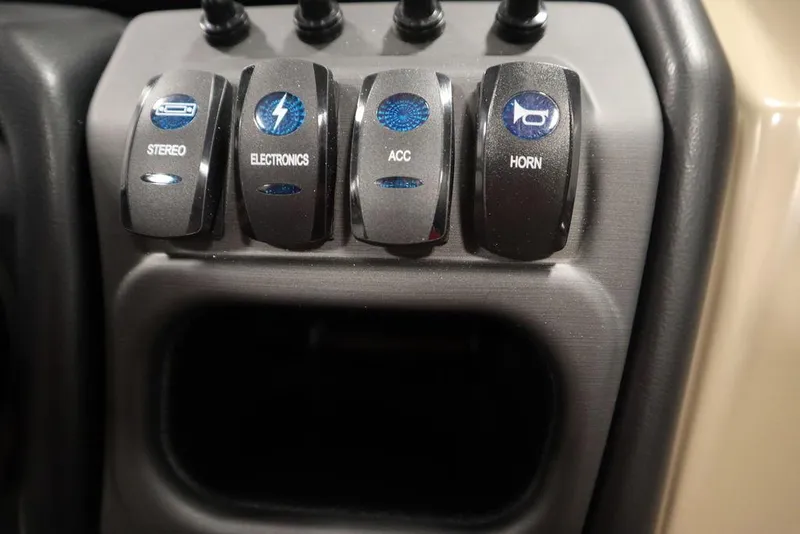 Slide: The Image of Control panel of 2025 Bentley Pontoons 223 QSB Tri-Toon with labeled switches. - 31