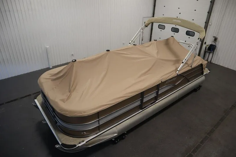Slide: The Image of 2025 Bentley Pontoons 223 QSB Tri-Toon with cover in storage. - 48